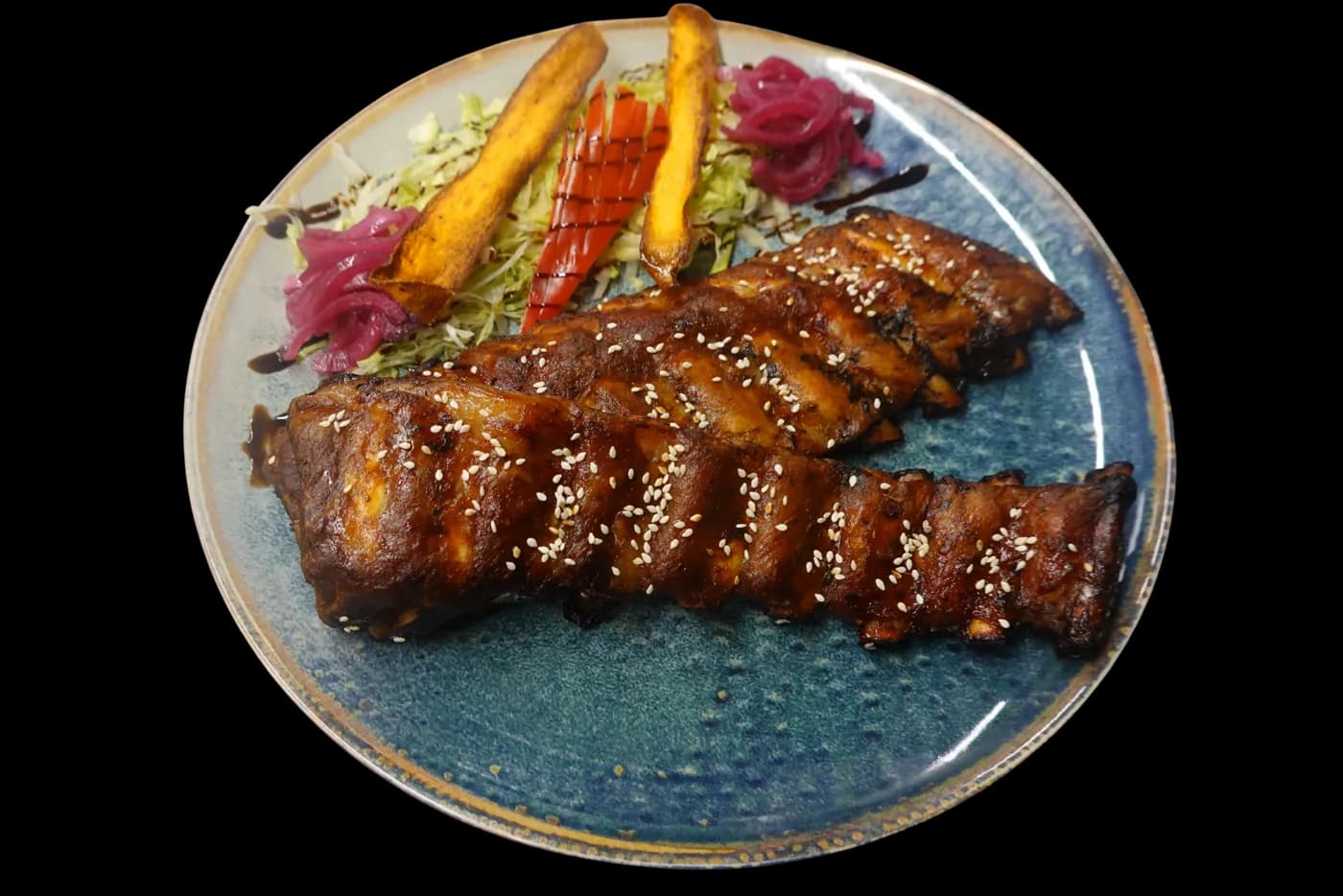 Coaste de porc rumenite la cuptor cu sos BBQ